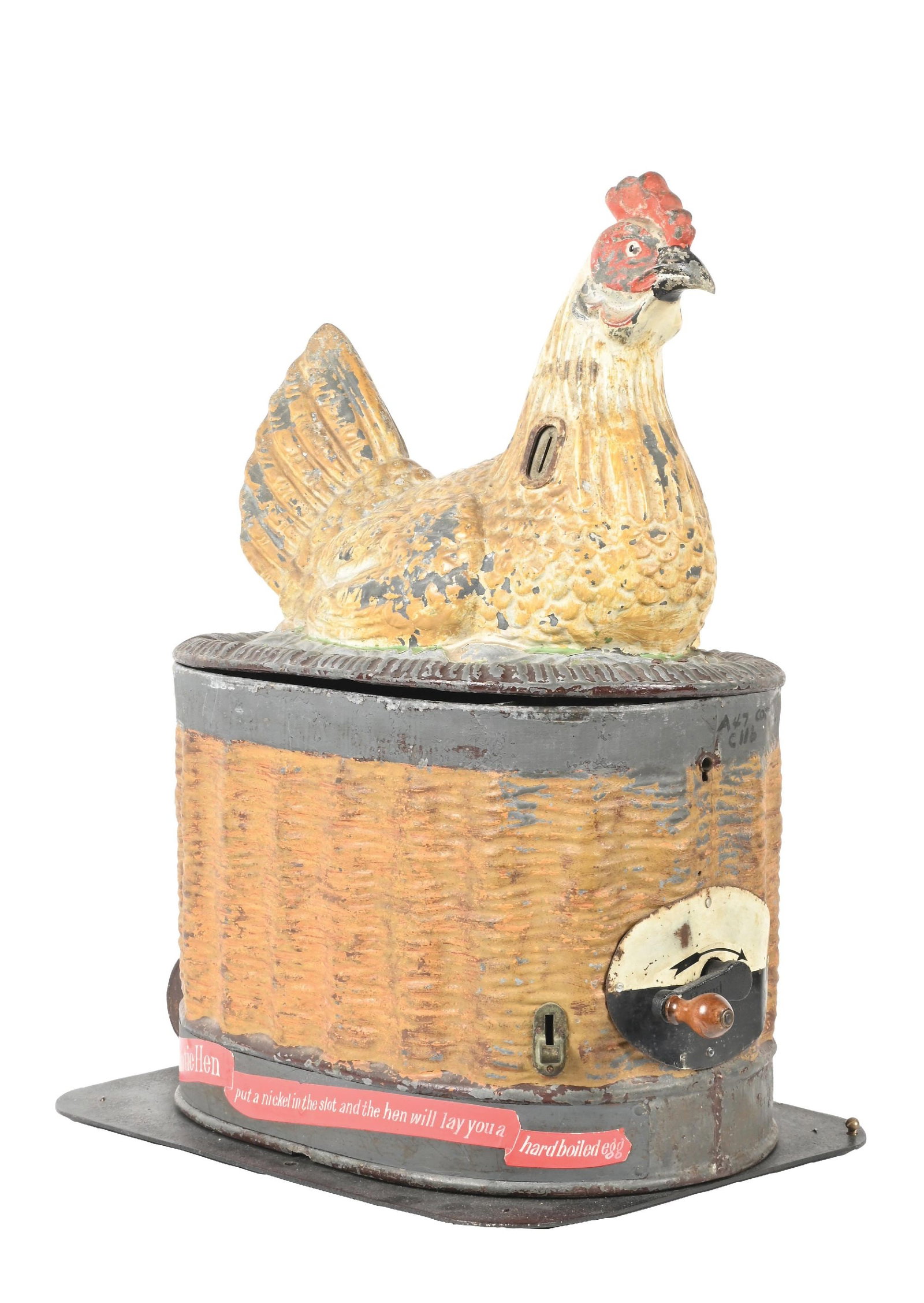 5¢ THE HEN WITH GOLDEN EGGS VENDING MACHINE: This cast iron vending amusement machine features a chicken seated on top of a basket with a front plaque instructing the operator to pull knob for a "surprise". When the coin is inserted and knob is 
