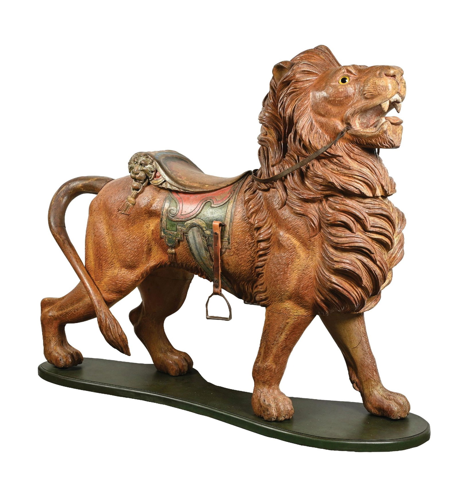 PHENOMENAL CARVED CAROUSEL LION ATTRIBUTED TO DENTZEL CAROUSEL COMPANY: Circa 1890–1910, attributed to the Dentzel Carousel Company, Philadelphia, Pennsylvania, monumental carved and painted wood menagerie carousel lion modeled in a striding pose with head