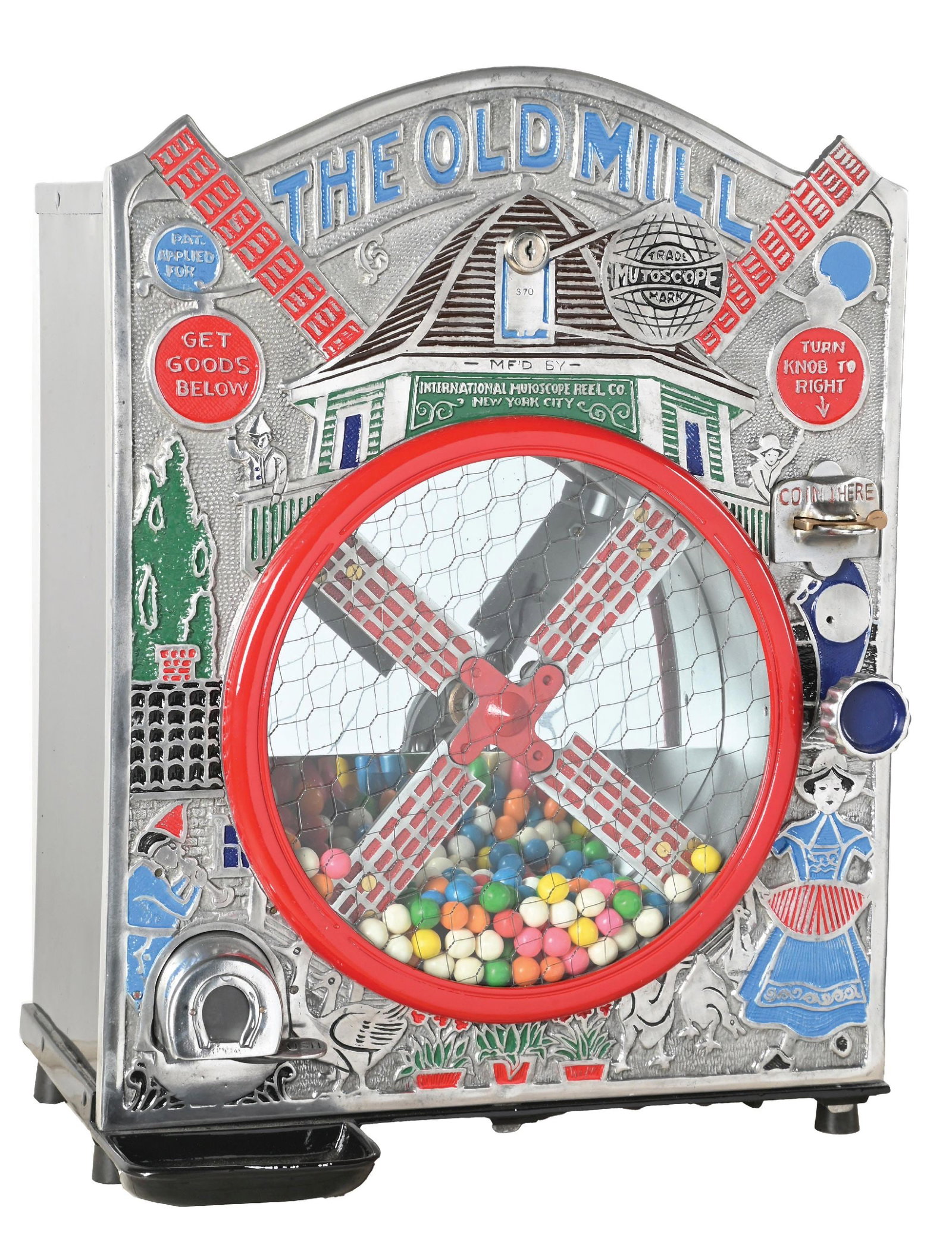 1¢ INTERNATIONAL MUTOSCOPE "THE OLD MILL" CIRCUS VENDING MACHINE: C. 1925. CONDITION: It shows an older park paint to the tin box. It has original older paint to the front casting. It has an original fill door and hardware. There are some areas of paint loss, oxidat