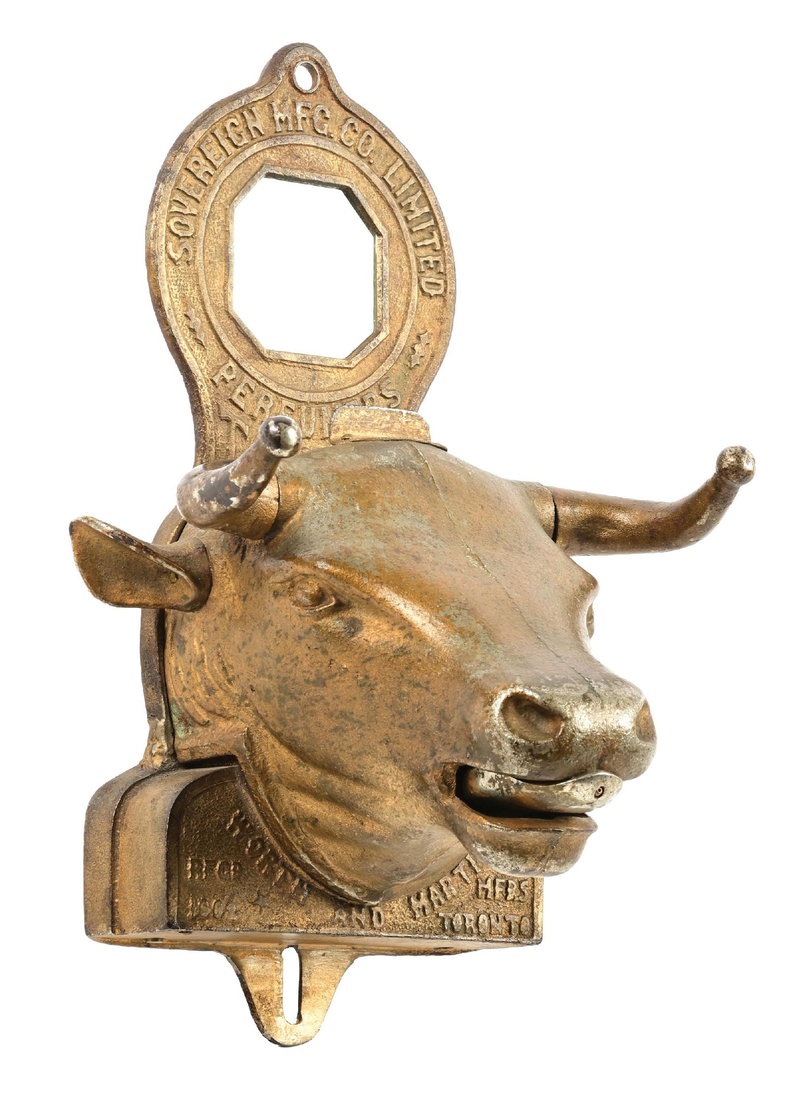 SOVEREIGN MFG. CO., BULL'S HEAD PERFUME VENDING MACHINE: This C. 1900 cast iron one cent vendor in the form of a bull's head from the Sovereign Manufacturing Company features a mirror insert at the top. This is a Canadian vendor and takes the larger Canadia