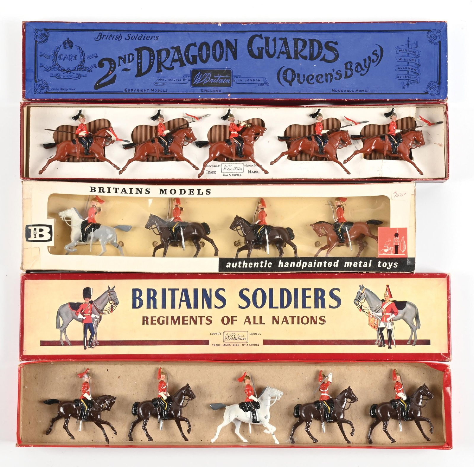 LOT OF 3: W. BRITAIN SETS IN BOXES: (A) Prewar 2nd Dragoon Guards No. 44 lancers with bugler. Original inserts. 5 pieces. (B) 1st King's Dragoon Guards No. 9212. Re-tied in box. Poor cello box, excellent figures. 4 pieces. (C) 1st Drago