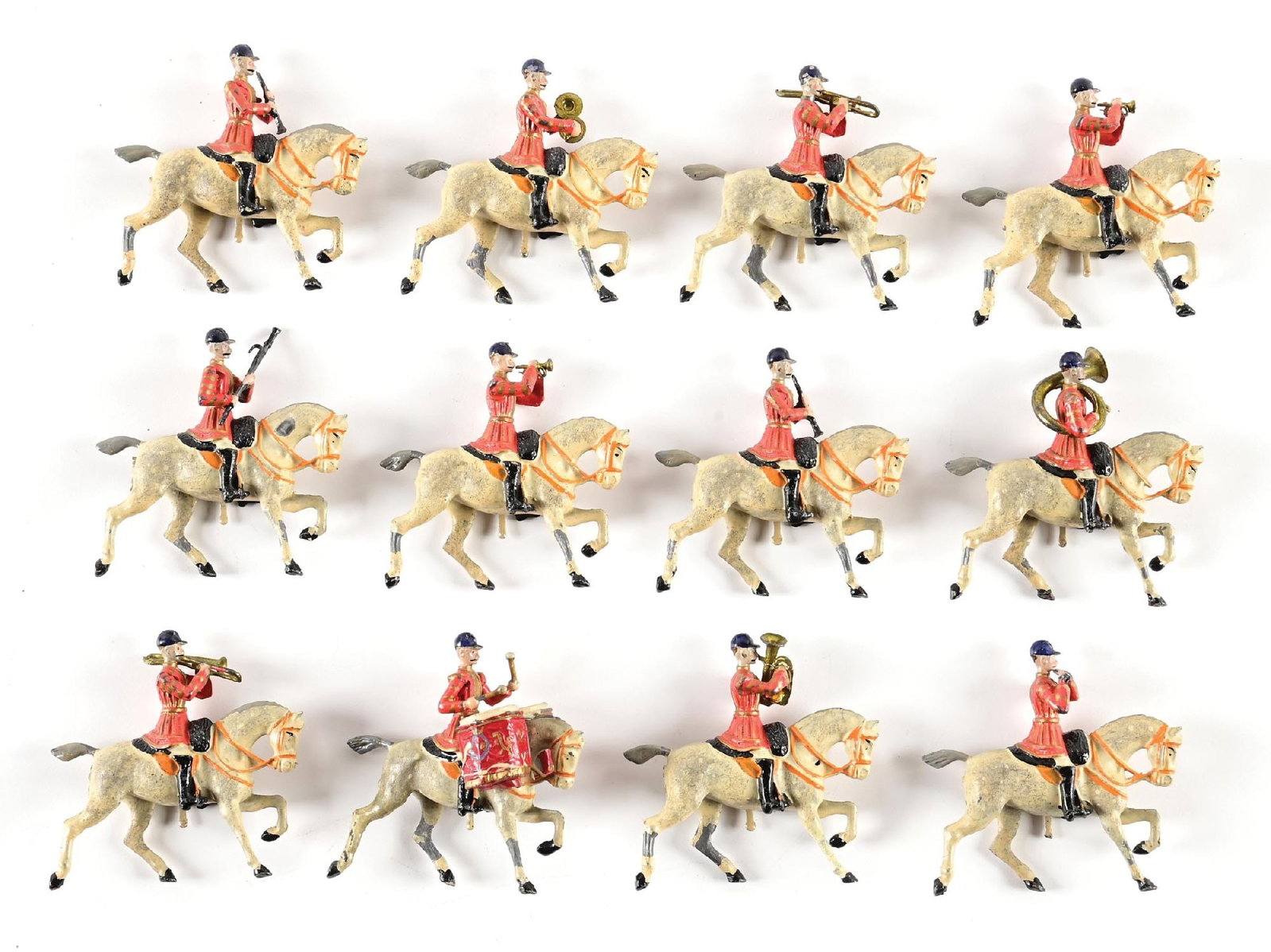 PRE-WAR BRITAINS SET NO. 101 GRENADIER GUARD MOUNTED BAND LOOSE SET: Early red jacket version. No box. 12 pieces. Condition: Dimensions: 3" x 3" x 1 - 1/2".