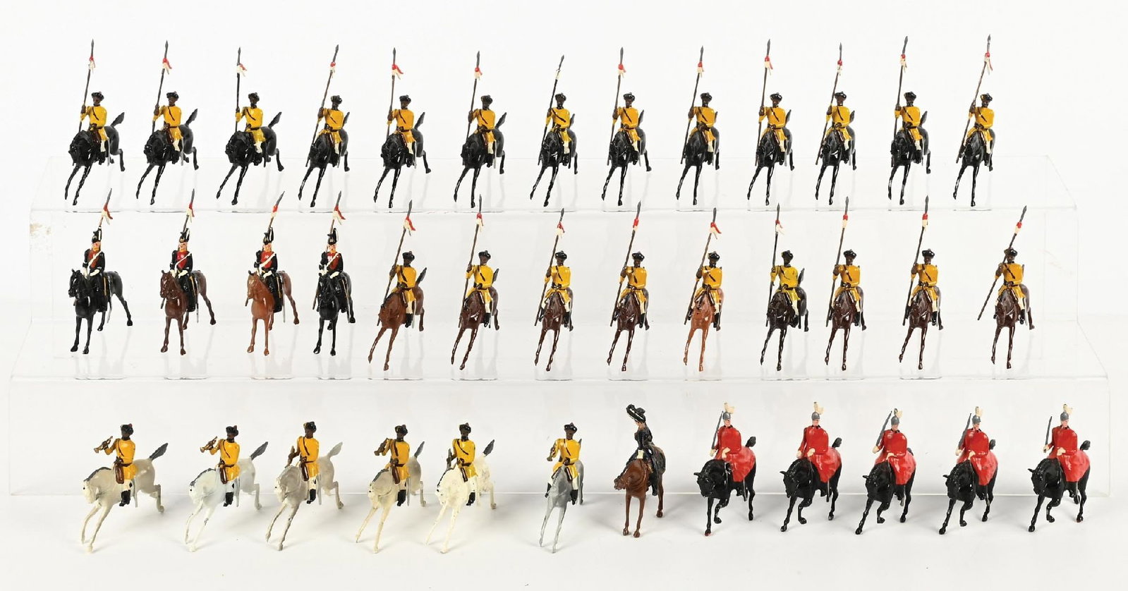 LOT OF W. BRITAINS TOY SOLDIERS: Lot consists of Skinner's Horse from Set No. 47, 21 Lancers and 6 Buglers, 9th Queen Royal Lancers No. 24, 5 Lifeguards in Winter Cloaks Set No. 400. Condition: Dimensions: 17" x 11 - 1/2" x 8".