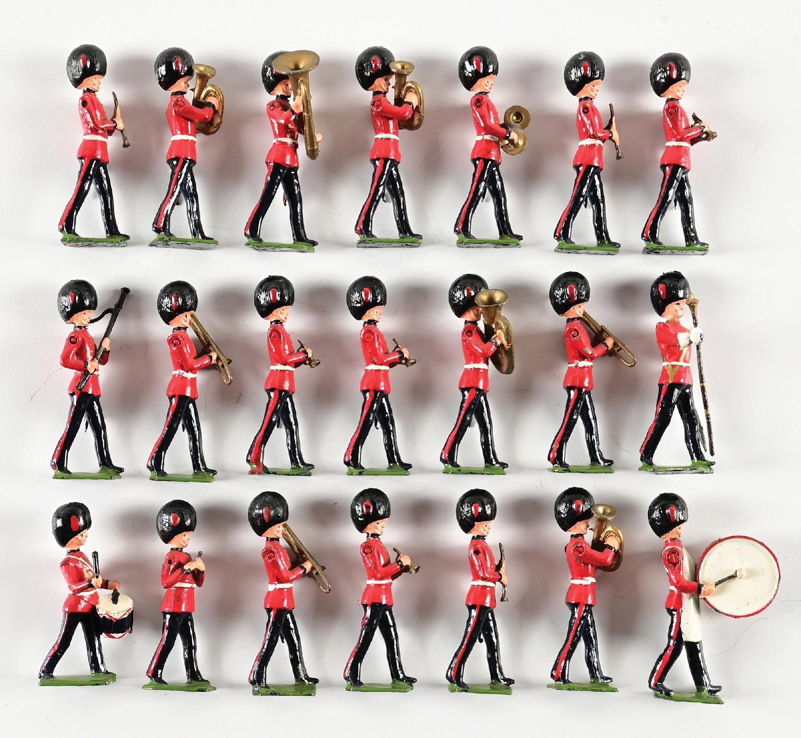 W. BRITAINS COLDSTREAM GUARD LOOSE 21-PIECE ASSORTMENT: Metal drums. 21 pieces. Condition: Dimensions: Largest: 2 - 3/8" x 1 - 1/2" x 5/8".