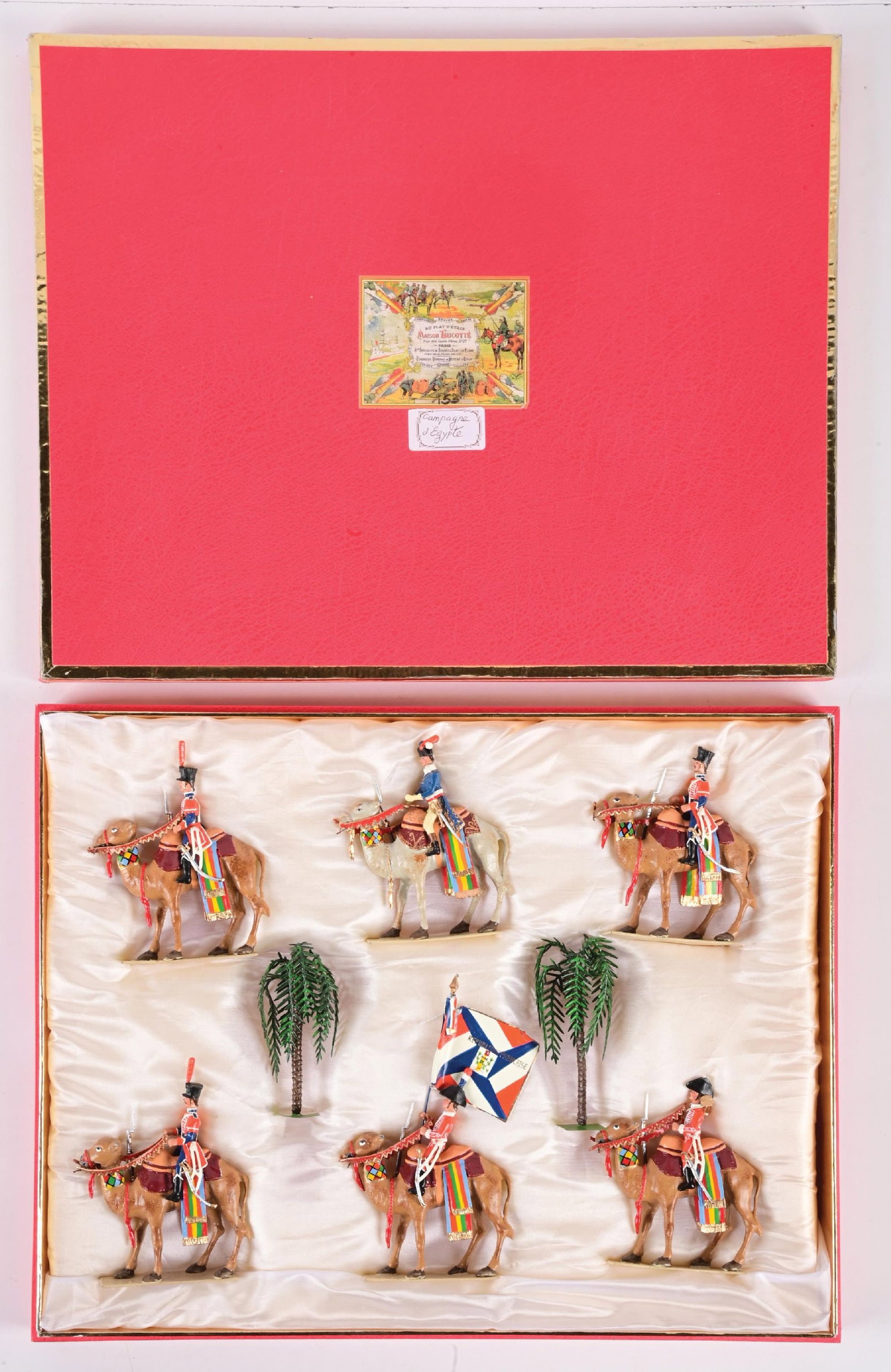 LUCOTTE EGYPTIAN CAMPAIGN: Napoleonic Camel Corps with standard, palm trees, and insert. Bends and chipping on flag. 8 pieces. Condition: Dimensions: 15 - 1/2" x 12 - 1/4" x 2".