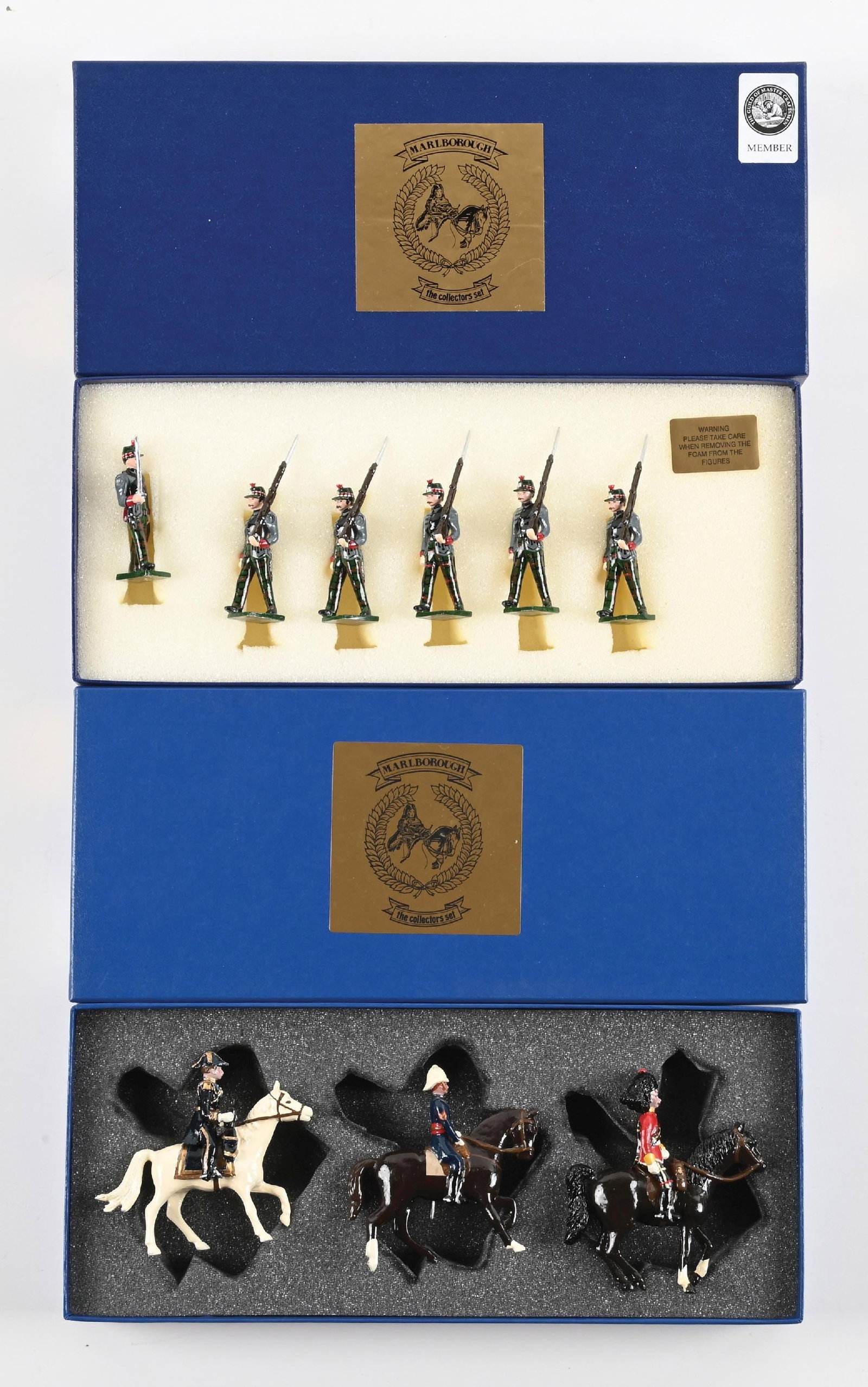 LOT OF 2: MARLBOROUGH MINIATURES MILITARY: (A) Highlanders Marching Shoulder Arms with Officer. 6 pieces. (B) Mounted British Officers. 3 pieces. 9 pieces total. Condition: Dimensions: Each Box: 12 - 1/4" x 5 - 1/4" x 1 - 5/8".