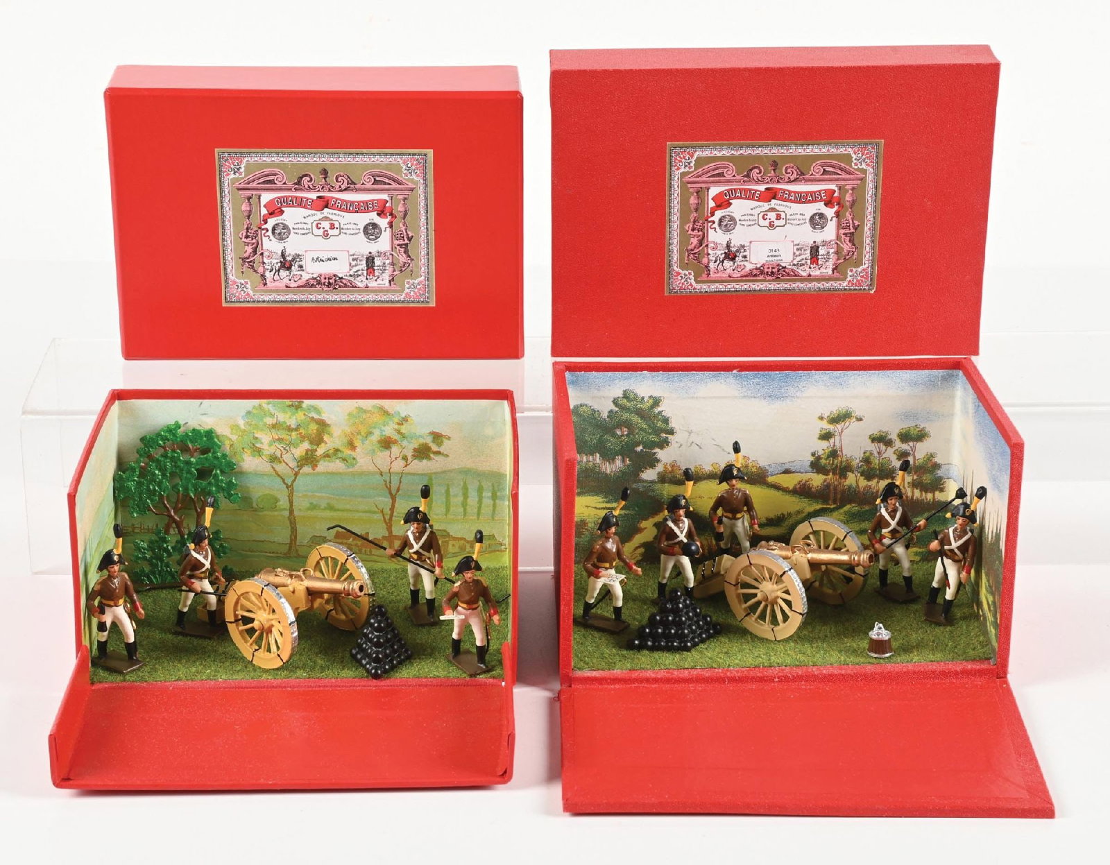 LOT OF 2: MIGNOT SETS IN BOXES: (A) Austrian Cannon Crew. Loose in box. 7 pieces. (B) Austrian Artillery in fold-down diorama box. 8 pieces. 15 pieces total. Condition: Dimensions: Largest Box: 8" x 5 - 3/4" x 4 - 1/4".