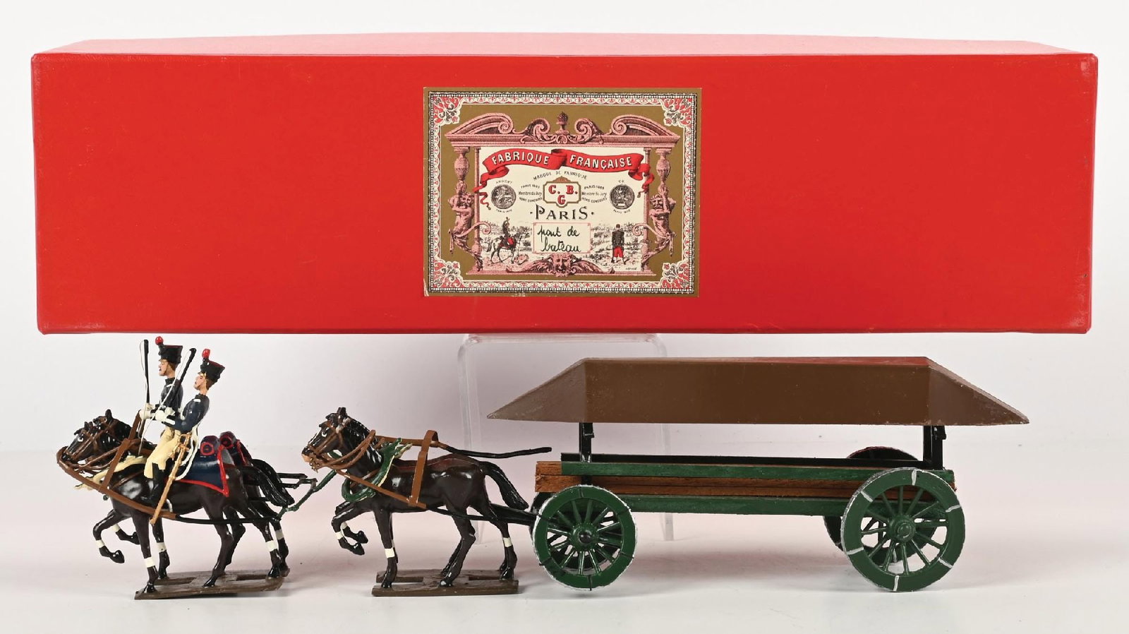 MIGNOT HORSE-DRAWN PONTOON WAGON IN BOX: Complete and in excellent condition. 7 pieces. Condition: Dimensions: Box: 15 - 1/4" x 4 - 1/4" x 5 - 1/4".
