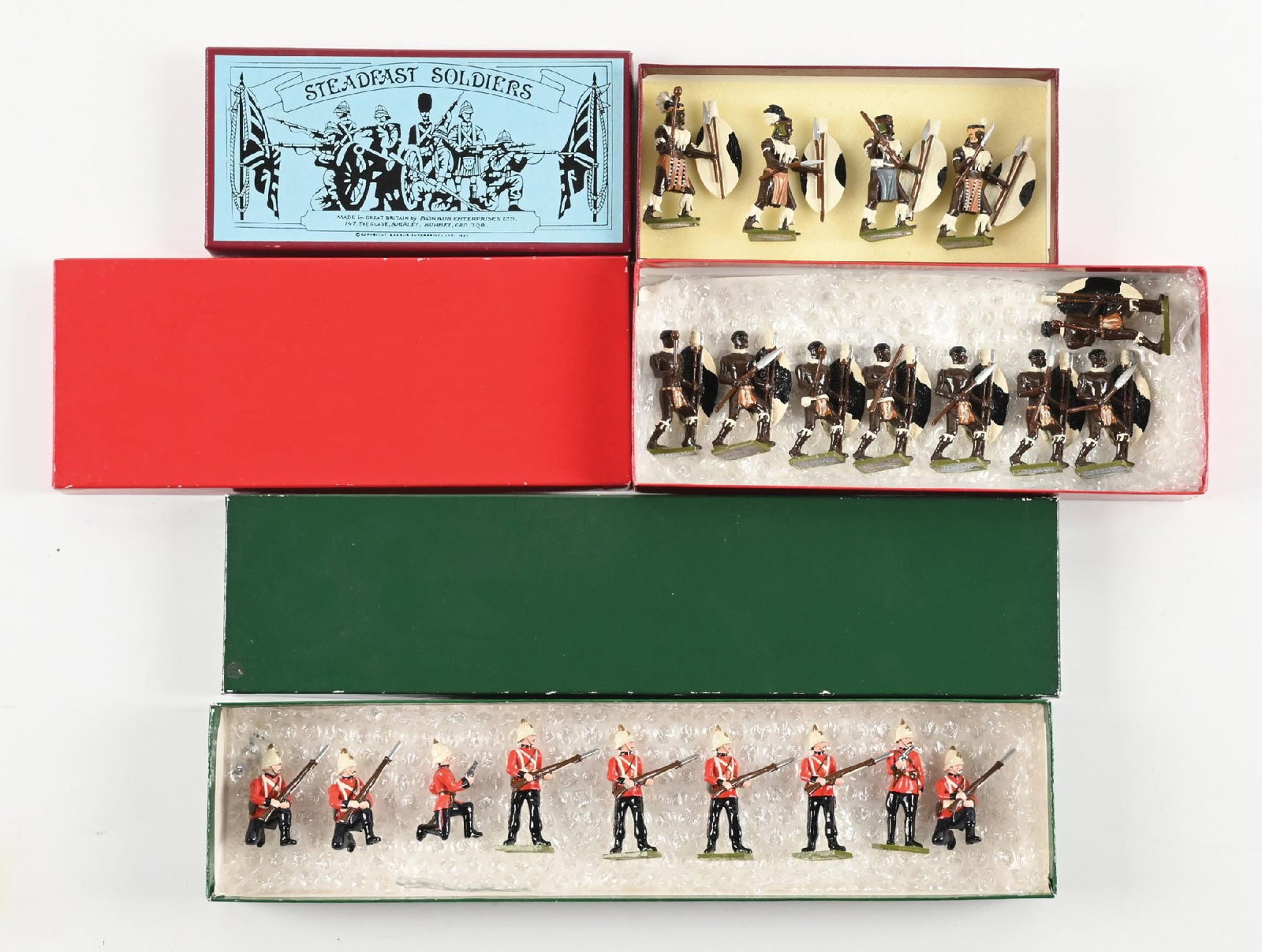 LOT OF 3: STEADFAST TOY SOLDIERS: (A) Zulus SF31. 4 pieces. (B) Zulus. Incorrect box. 8 pieces. (C) 24th Foot. Incorrect box. 9 pieces. 21 pieces total. Condition: Dimensions: Largest Box: 15" x 3 - 1/2" x 1 - 1/2".