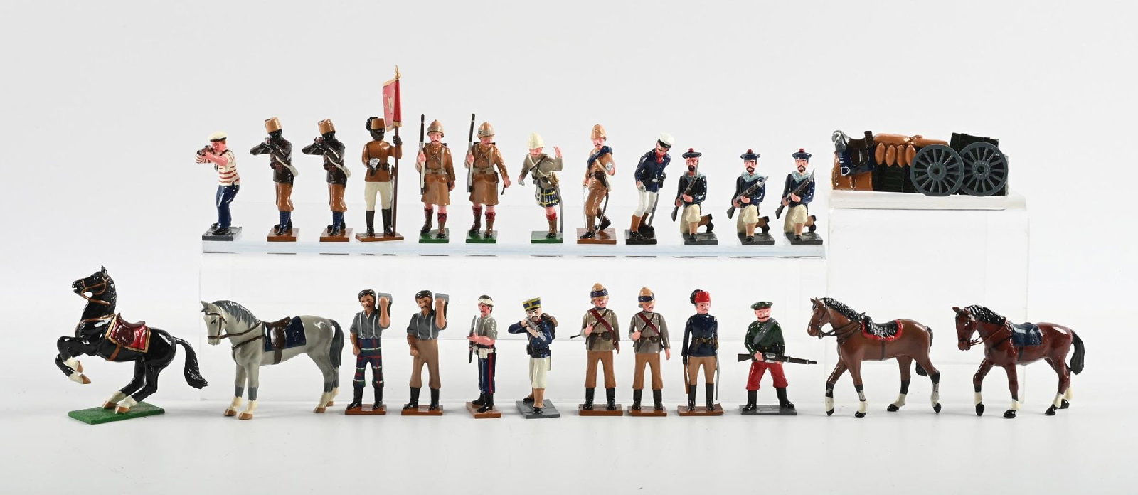 TROPHY MINIATURE ASSORTMENT: Includes Boxer Rebellion figures, Sudan War figures, Camp Supplies, and 4 Riderless Horses. No original box. 25 pieces total. Condition: Dimensions: Box: 17" x 16 - 1/4" x 3".