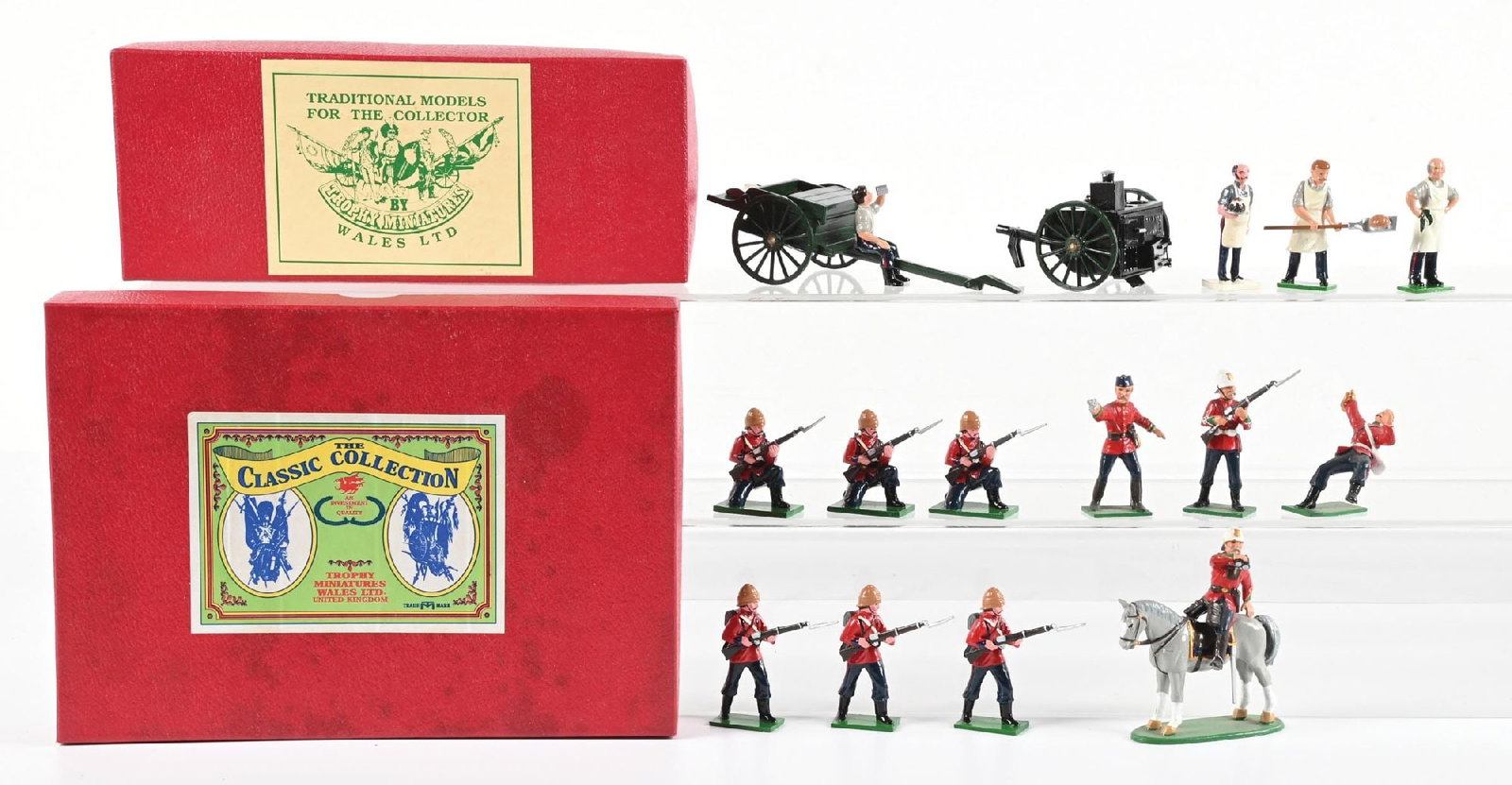 LOT OF 3: TROPHY SETS IN BOXES: (A) Zulu War Cook Wagon and Butcher's Wagon in generic Trophy box. 6 pieces. (B) Zulu Wars 24th Foot Advancing. 6 pieces. (C) Zulu Wars 24th Foot with mounted officer and wounded bugler. 4 pieces. 16 