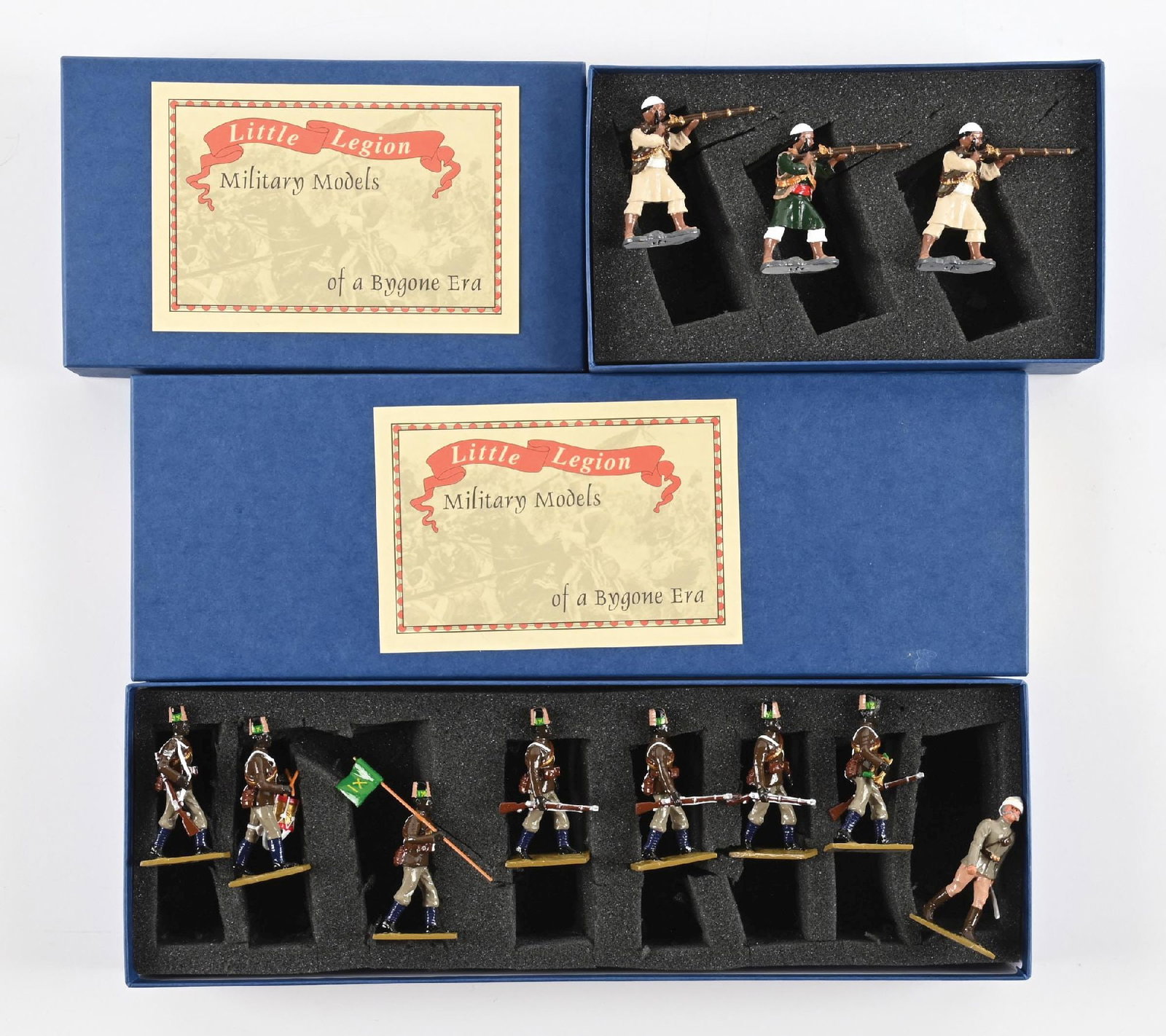 LOT OF 2: TROPHY MINIATURES: (A) Afghan Rifleman. Incorrect Box. 3 pieces. (B) Little Legion Sudanese Special Set Egyptian Army Marching at the Trail with Colors, Bugler, Officer, and Drummer in original box. 8 pieces. 11 pieces