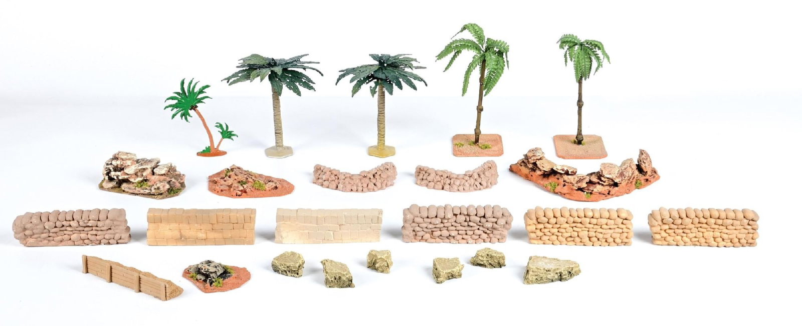 SCENIC DESERT DIORAMA LOT: Consists of Palm Trees, Rock Formations, Mealie Bags and Sandbag Walls. 25 pieces total. Condition: Dimensions: 17" x 11 - 1/2" x 8".