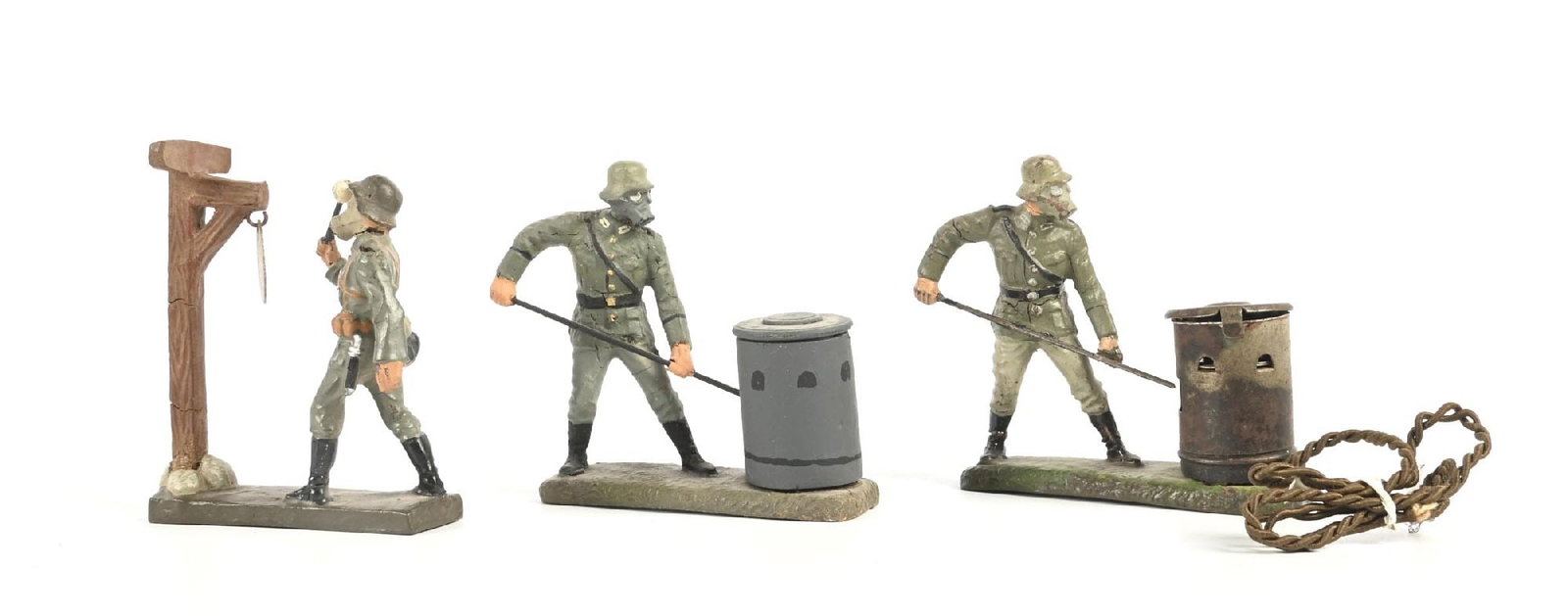 LOT OF 3: LIONEL WEHRMACHT FIGURES: Includes Gas Alarm, Waste-Burning with Gas Mask, and 1 restored Waste Burning with Gas Mask (replaced burner). Condition: Dimensions: Largest: 3 - 1/4" x 1 - 1/8" x 3".