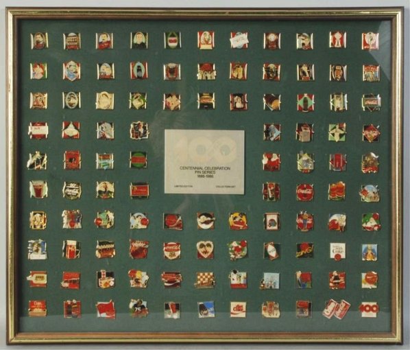 1986 Coca-Cola Centennial Pin Series Set.: Complete in original frame. Condition (Near Mint). Size Framed: 21 - 1/2" x 25 - 1/2".