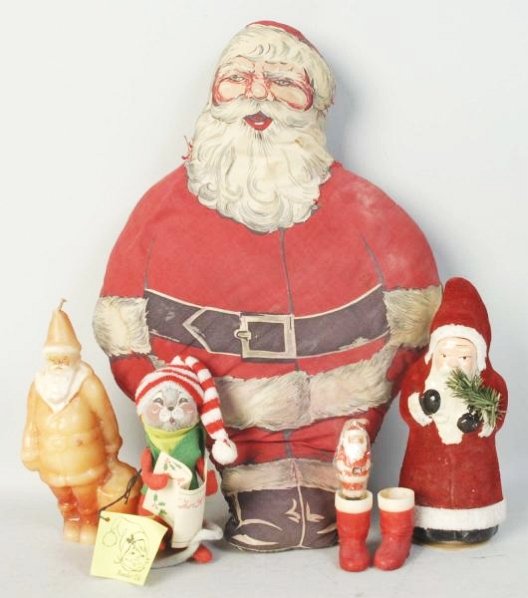 Lot of Santa Items.: Vintage cloth stuffed Santa, small wax Santa, pair of wax Santa candy container boots; Santa candle; reproduction Belsnickel candy container, Ann
