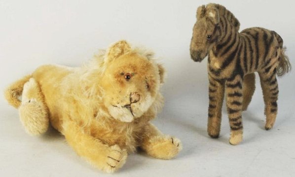US Zone Steiff Zebra & Lion.: 1920s zebra with US Zone tag and in wool plush material. Some mohair loss. 1920s Steiff jointed lion, fully jointed, no ID. Condition (Excelle
