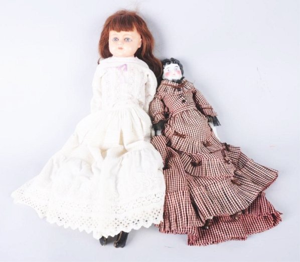 Lot of 2: Antique Dolls.: 1890s china shoulder head with old cloth body and china limbs, very nicely dressed; papier-mâché shoulder head (fully repainted) with original bo