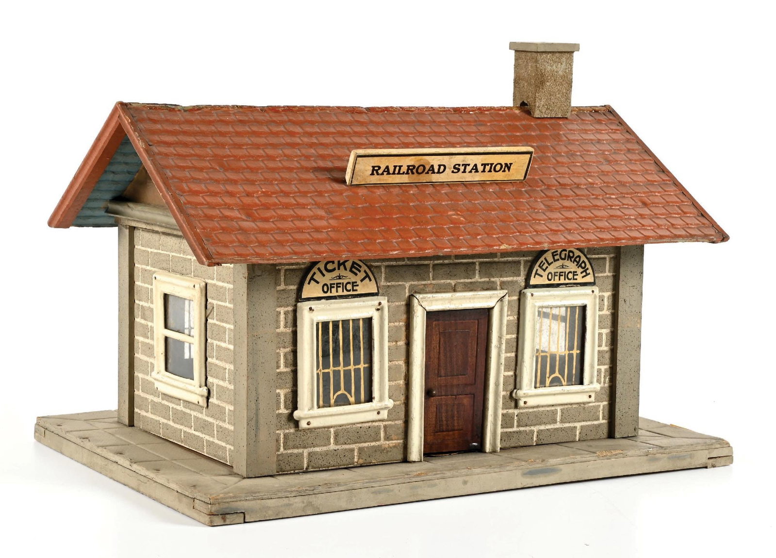 EARLY SCHOENHUT NO. 121 RAILROAD STATION MADE FOR LIONEL: Complete and all original; however, the rooftop signs are a little loose. It is otherwise in excellent condition. Condition: Dimensions: 17" x 12-3/4" x 12-1/2"