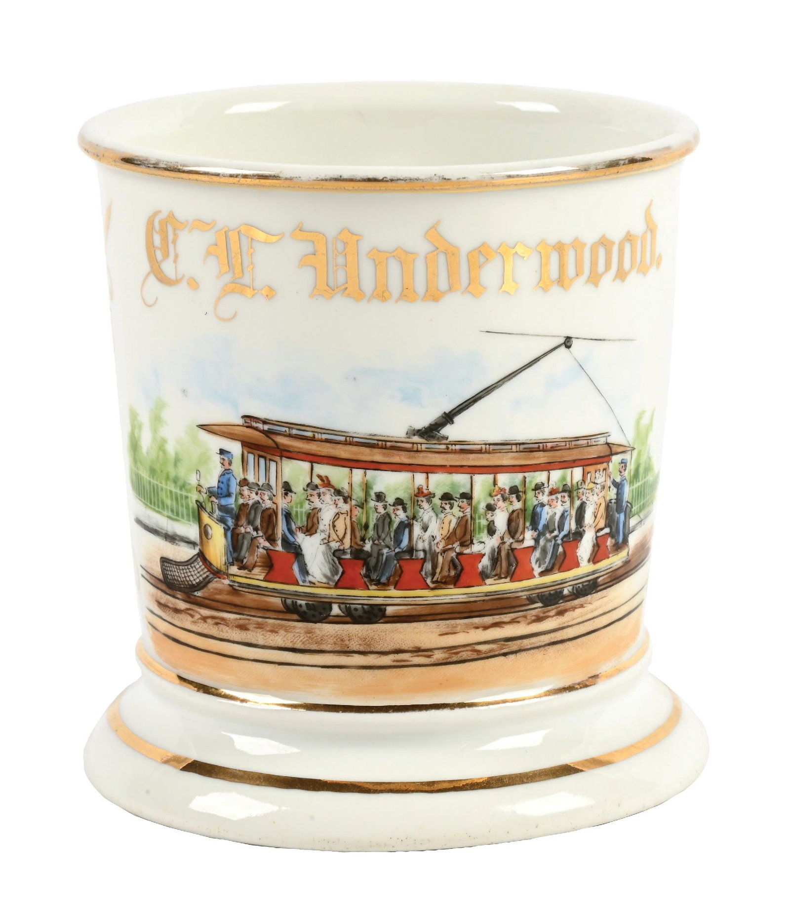 TROLLEY OPERATOR'S SHAVING MUG: Has the name "C.F. Underwood" in gold gilt. Stamped "Vienna Austria" under base. Detailed image of man operating a full electric-driven trolley. Condition: (Excellent). Dimensions: 3 - 1/2" Dia. x 4".