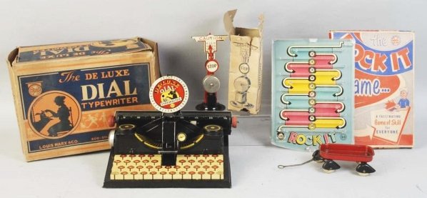 Lot of 4: American Made Toys & Games.: Includes Marx typewriter in original box, Marx Rock It game in original box, Marx train signal in partial original box, and a small Wyandotte wagon. Condition (Very Good). SizeLargest Box: 11 - 1/2" x