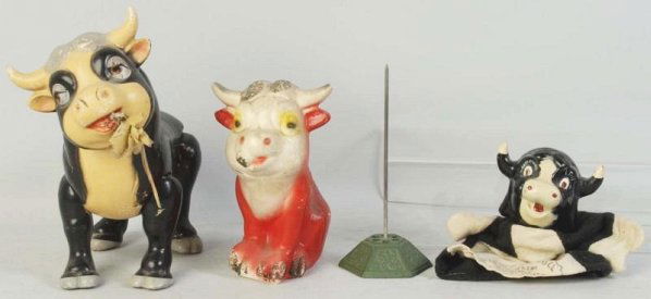 Lot of 3: Ferdinand the Bull Items.: Composition. Includes one hand puppet marked "1938" and "Crown Toy Co.", one jointed Ideal standing figure, and one small Disney-inspired carnival statue. Some crazing and wear throughout. Condition (