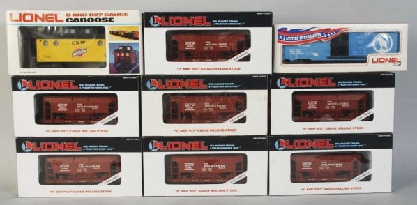 Lot of 9: Lionel Freight Train Cars.: Contemporary. Includes seven Milwaukee Road Ore cars, one boxcar, and one caboose. Includes all original boxes with some wear. Condition (Excellent).