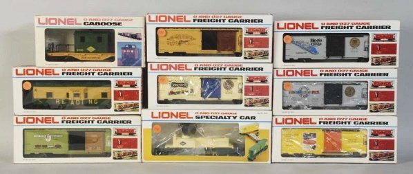 Lot of 9: Lionel Freight Train Cars.: Contemporary. Includes two Reading cabooses, one Reading searchlight car, and six Train Manufacturer boxcars. Includes all original boxes with some wear. Condition (Excellent).