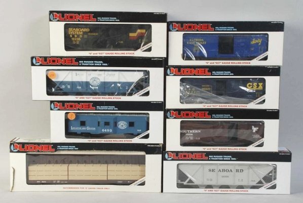 Lot of 8: Freight Train Cars.: Contemporary. Includes four boxcars, two hopper cars, one flat car, and one caboose. Includes all original boxes with some tearing and creasing. Condition (Excellent).