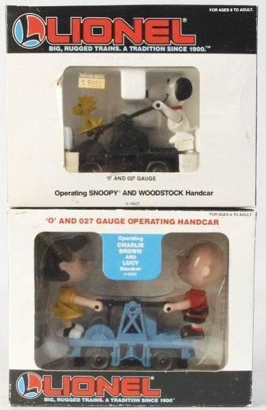 Lot of 2: Lionel Peanuts Theme Handcars.: Contemporary. O and O27-guages. Includes one with Charlie Brown and Lucy and the other with Snoopy and Woodstock. Both handcars are unused and in their original boxes. Boxes havesomeedge wear and slig