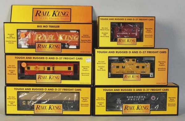 Lot of 6: MTH Rail King Freight Train Cars.: Contemporary. Three-rail. Includes three cabooses, one hopper car, one gondola car, and one Big Mo trailer. Includes all original boxes. Condition (Near Mint).