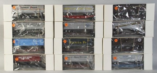 Lot of 12: Freight Train Cars.: Contemporary. All are miscellaneous flat cars with trailers. Includes generic boxes. Condition (Near Mint).