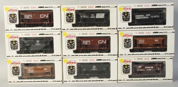 Lot of 9: Atlas Ore Train Cars.: Contemporary. O-gauge. Five various styles. Includes all original boxes. Condition (Excellent).