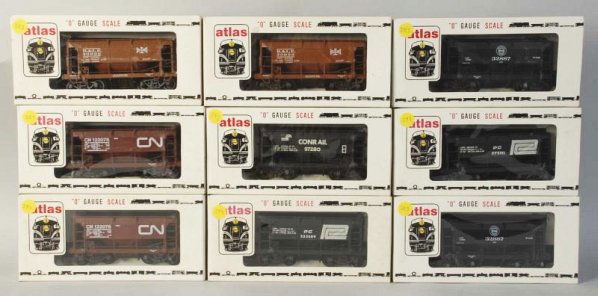 Lot of 9: Atlas Ore Train Cars.: Contemporary. O-gauge. Five various styles. Includes all original boxes. Condition (Excellent).