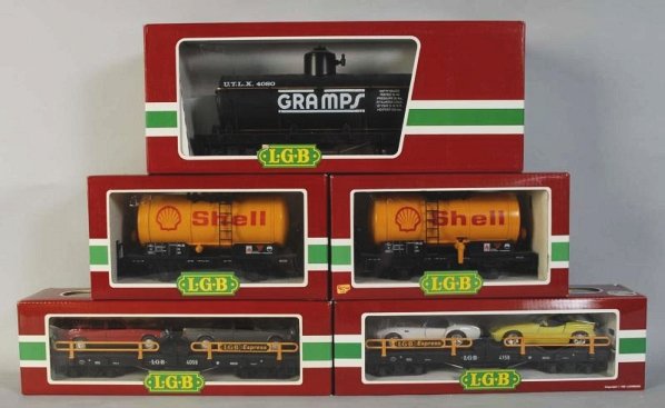 Lot of 5: German LGB Freight Train Cars.: Contemporary. G-gauge. Marked "Made in Western Germany". Includes three tank cars and two flat cars with automobiles. Includes original boxes. Condition (Near Mint).