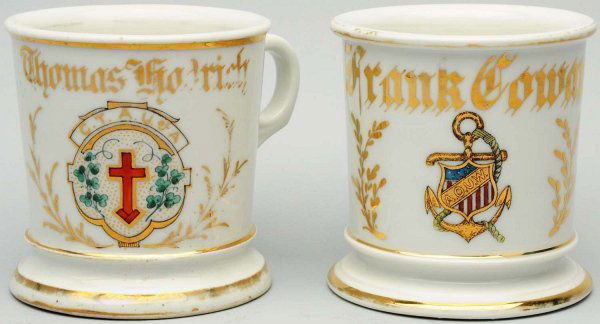 Lot of 2: Fraternal Shaving Mugs.: Includes one depicting a red cross, with "C.T.A. U. of A." and "Thomas Hadrich" in gold gilt. Stamped, "P. Germany 8/12". Moderate loss of gold. The second mug is an Ancient Order Of United Workmen, a
