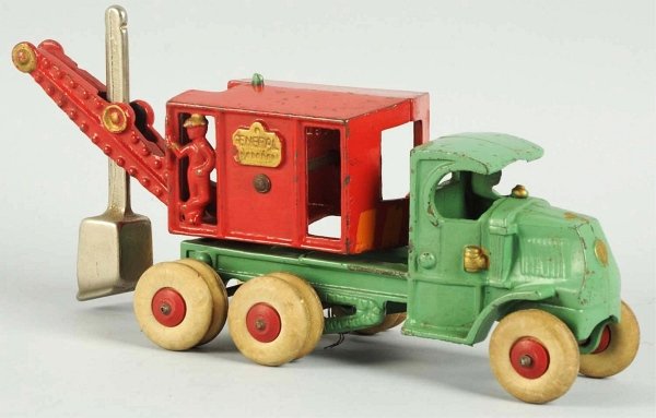 Cast Iron Hubley General Digger Toy.: American. Original white rubber tires, original shovel, molded driver, and rear figure inside digger. Marked "General Digger" on both sides of rear. Tires have slight distress and toy has some minor p