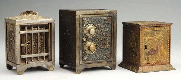 Lot of 3: Cast Iron Safe Banks.: Includes the Keyless Safety Deposit bank, the Jewel safe bank, and the Arabian safe bank. Condition (Very Good - Excellent). Size Largest: 6" T.