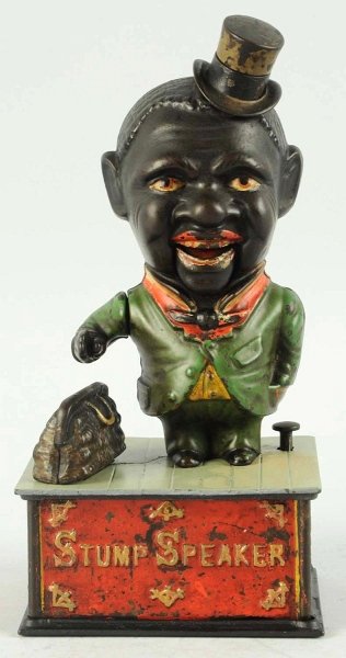 Cast Iron Stump Speaker Mechanical Bank.: Manufactured by Shepard Hardware Company. Working. Top plate has been repainted and bank has one crack. Condition (Very Good). Size 9 - 3/4" T.