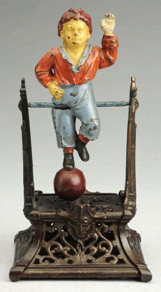 Cast Iron Boy on Trapeze Mechanical Bank.: Manufactured by Barton & Smith. All original. Condition (Excellent Plus). Size 9 - 1/2" T.