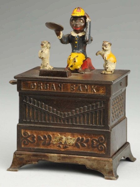Cast Iron Organ Cat & Dancing Dog Mechanical Bank: Manufactured by Kyser & Rex. Working. Condition (Excellent Plus). Size 7 - 1/2" T. ADDITIONAL INFO: The crank has been replaced.