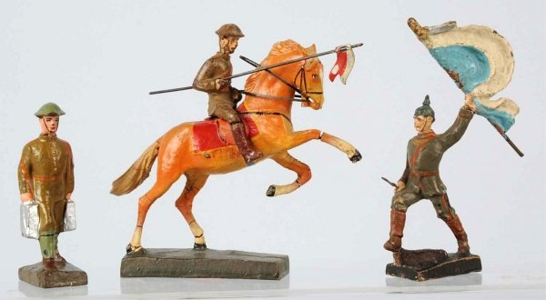 Lot of 3: Lineol 9 CM Figures.: Includes one flag bearer, one mounted soldier and one ammo carrier. The flagman has a composition flag. Horse is nice but the rider is rough. Condition (Very Good).