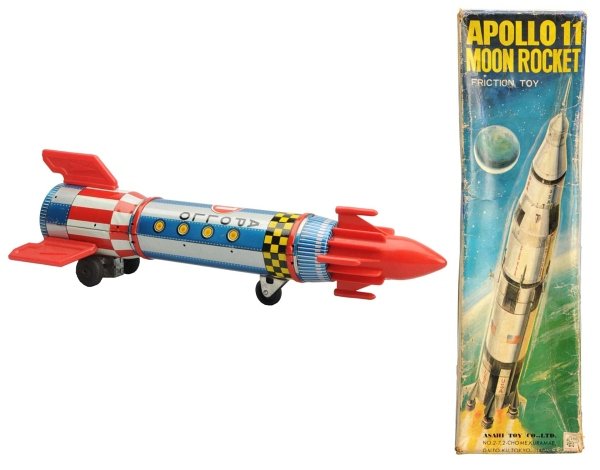 Tin Litho & Plastic Apollo 11 Moon Rocket.: Japanese, Asahi. Friction, working. Includes original box with several areas of creasing, some touchup on the edge and face, and a couple small tear repairs. Condition Toy (Near Mint) Box (Very Good).