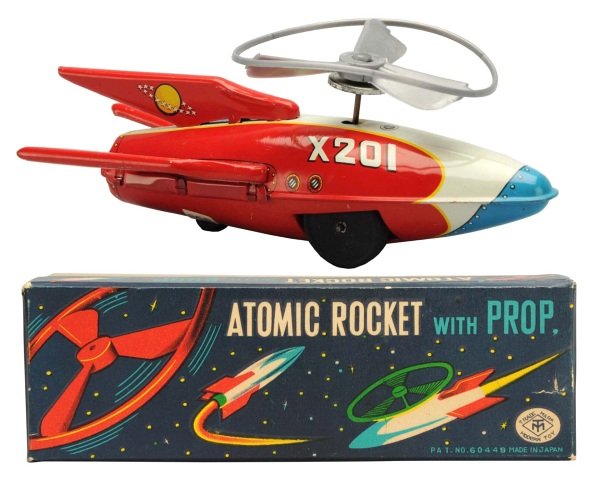 Tin Litho Atomic Rocket X-201.: Japanese, Masudaya. Working. Includes original box. Condition (Near Mint). Size 7 - 1/2" L.