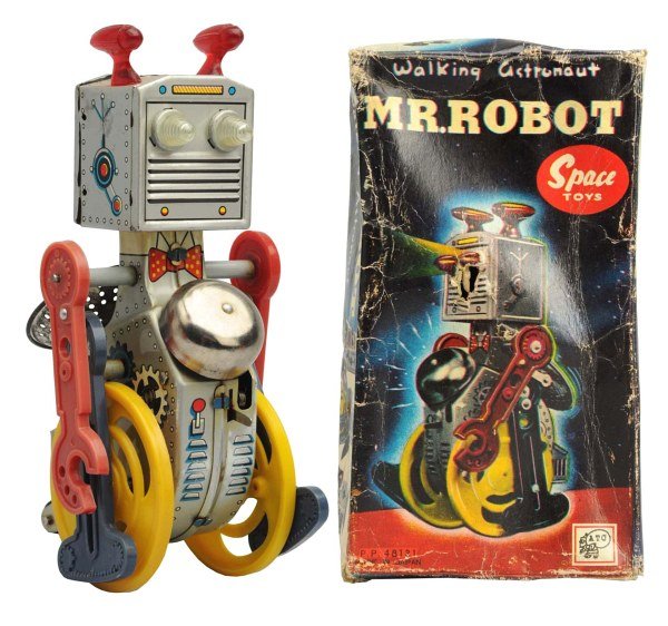 Tin Litho Wind-Up Mr. Robot.: Japanese, Asahi. Working. With some cracks to wheels where they attach to the axle and one split to leg. Original box included has several creases and one puncture to face of lid and box bottom. Condi