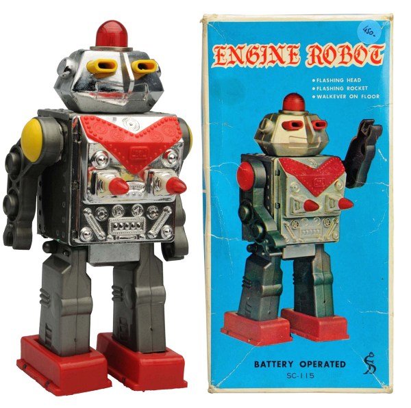 Painted Tin & Plastic Battery-Op Injun Robot.: Foreign. Working. Includes original box with some creasing and one small tear to one side panel. Condition Toy (Near Mint) Box (Excellent). Size 9" T.