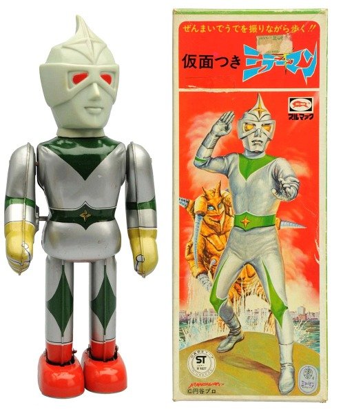 Tin Litho Wind-Up Mirror Man.: Japanese, Bullmark. Working. Includes original box with some minor creases and tape residue. Condition (Excellent - Near Mint). Size 9 - 3/4" T.