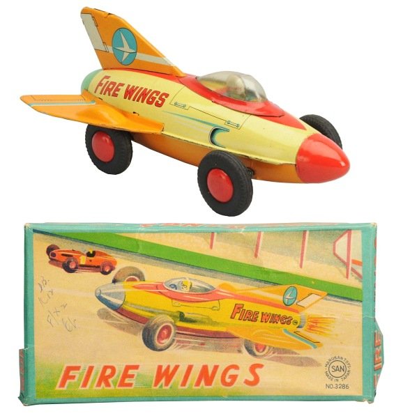 Tin Litho Friction Fire Wings.: Japanese, Marusan. Working but spark is weak. Includes original box with one corner tear and one tear in the end panel. Box also has some pencil writing and one clean tear along the face. Condition To