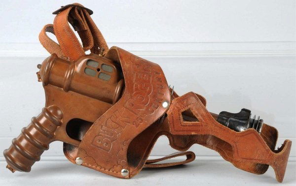 Daisy Buck Rogers 25th Century Rocket Pistol.: Bronze-colored version. Working. Marked "Buck Rogers 25th Century Disintegrator" on pistol. Some oxidation and pitting to bare metal parts. Includes very scarce original leather holster marked "Buck R