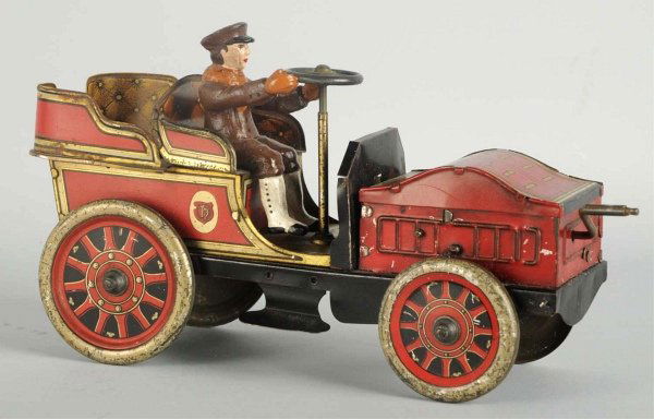 Early Tin Litho Flywheel Hess Race Car Toy.: German. Working; flywheel mechanism is operated by crank in front of car. Contemporary driver, replacement hood, and repainting to back of rear seat. Some scratching and edge wear to japanned edges an